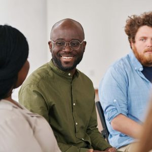 happy-young-black-man-looking-at-one-of-patients-d-UT6MESB.jpg